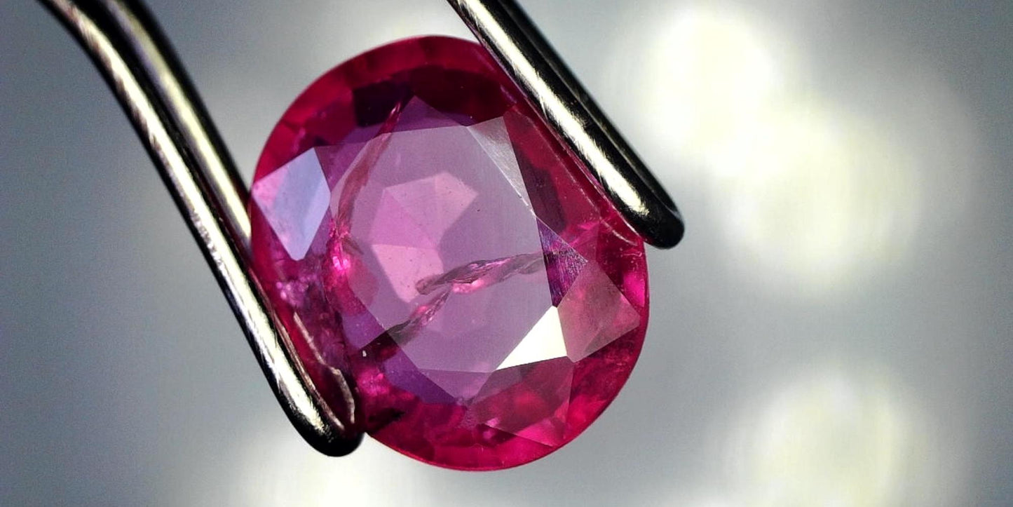 Captivating 0.81ct Oval Transparent Heated (Minor Residues) Natural Red Ruby: GIA Report #6203534776