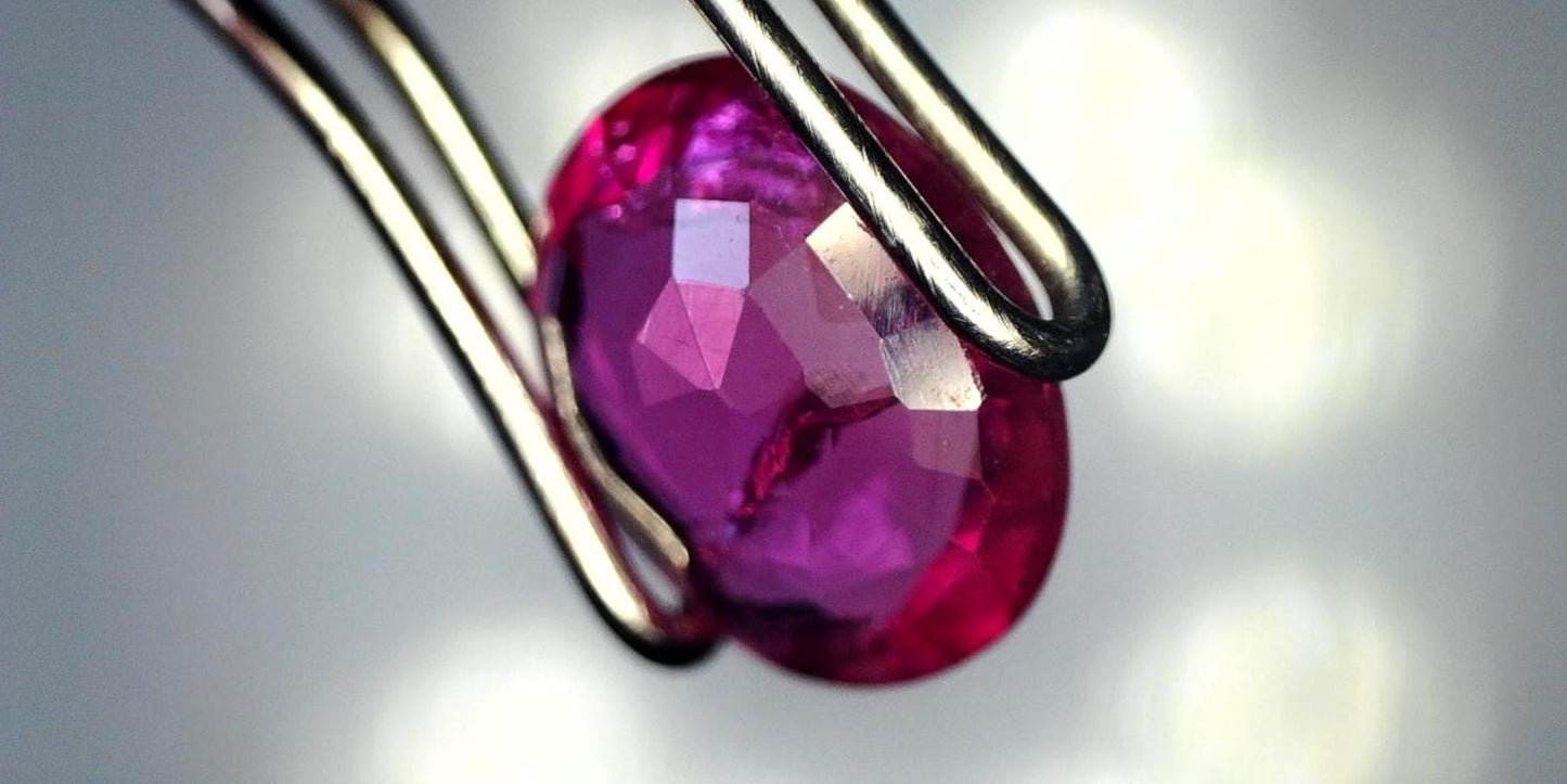 Captivating 0.81ct Oval Transparent Heated (Minor Residues) Natural Red Ruby: GIA Report #6203534776